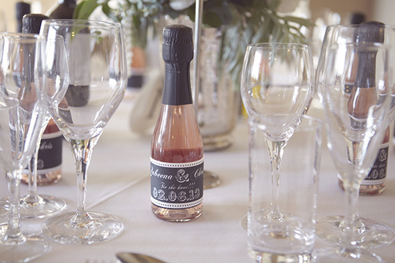 Mini champagne wedding favors | photo by Natalie J Weddings | Read more - https://www.100layercake.com/blog/?p=69104