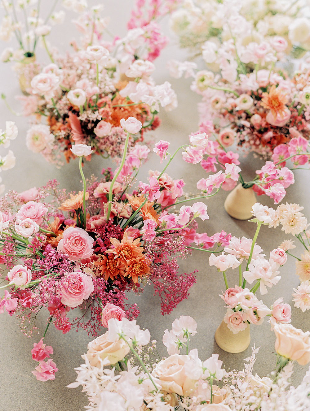 modern pink tablescape with dried floral arch