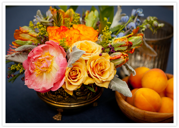 vibrant floral centerpiece in gold vase