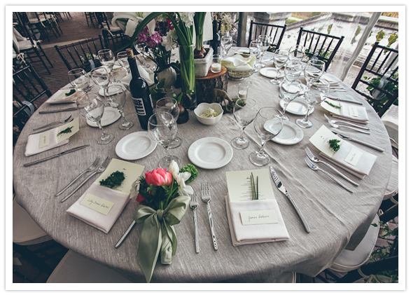 gray linens and vibrant floral centerpieces