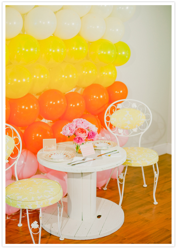 balloon backdrop and delicate dining table