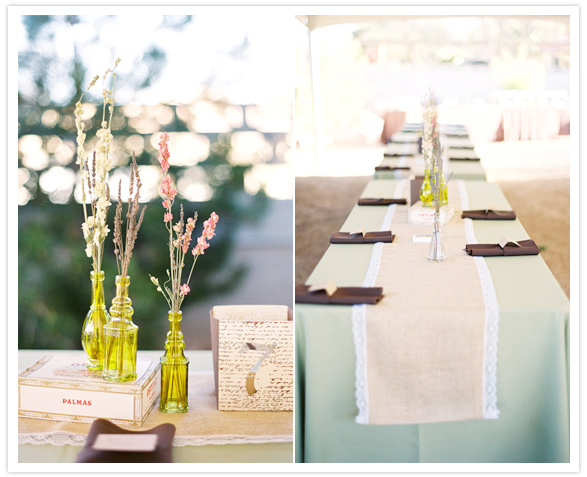 burlap table runner and colored bottle vases
