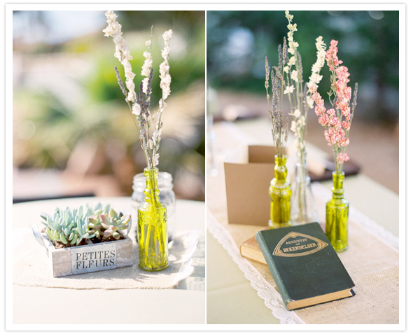 simple succulent, stacked books and colored vase centerpieces