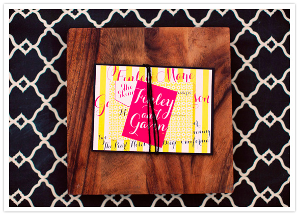 bright yellow and pink with black pattern invitation suite