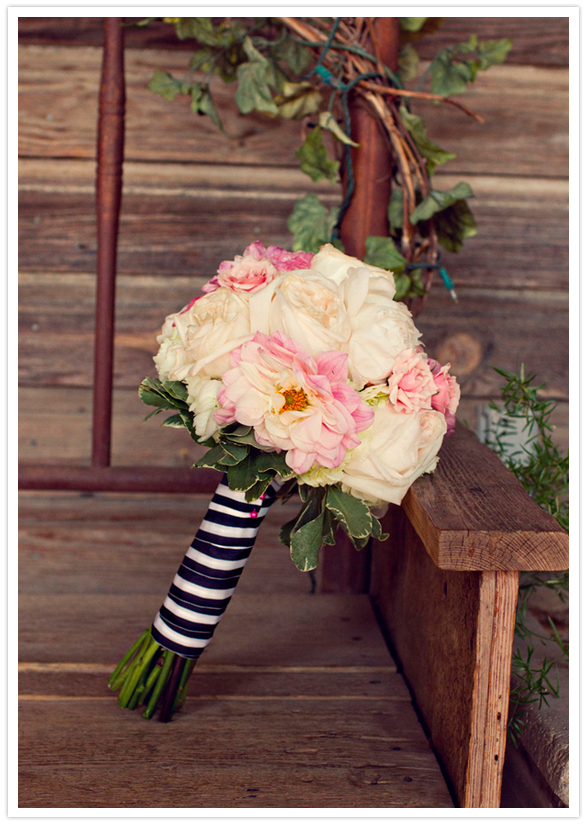 blush pinks and white rose bouquet with striped ribbon