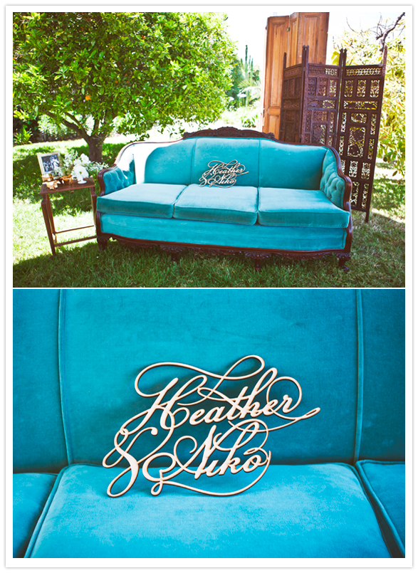 vintage turquoise velvet sofa and gold metal name embellishment
