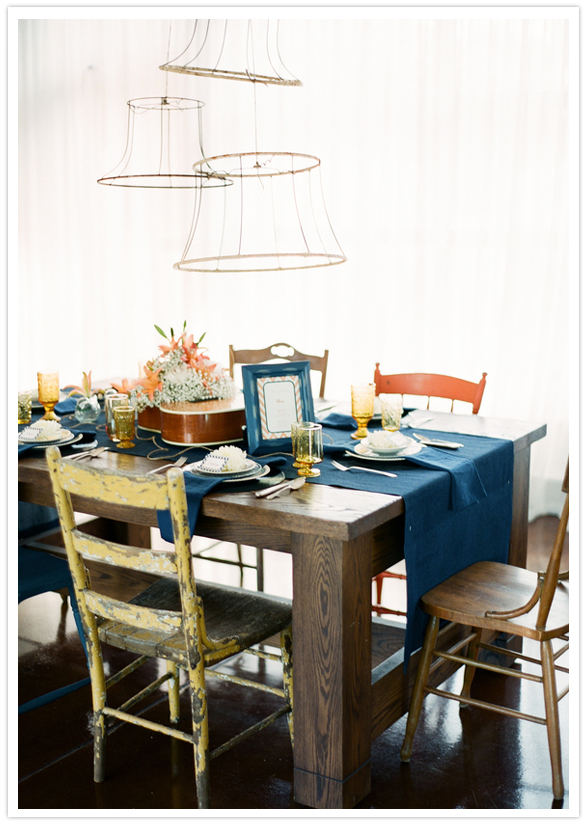 multicolored table chairs and denim linens