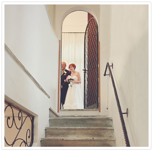 father and daughter walk down the aisle