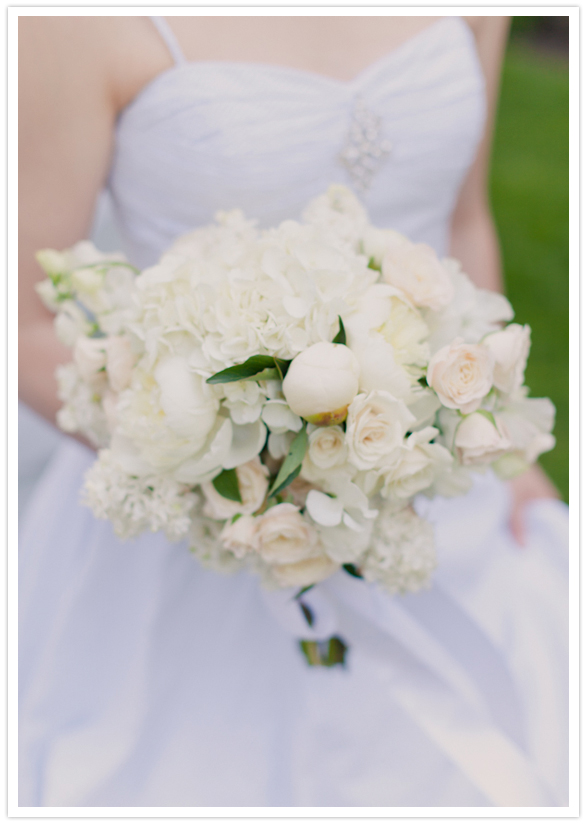 all white bouquet with green accents