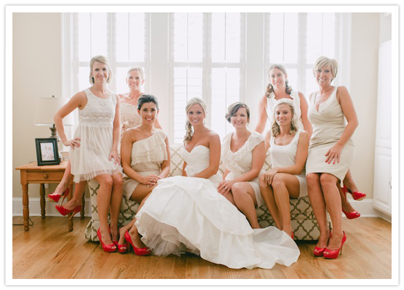 ivory and champagne bridesmaid dresses matched with red heels