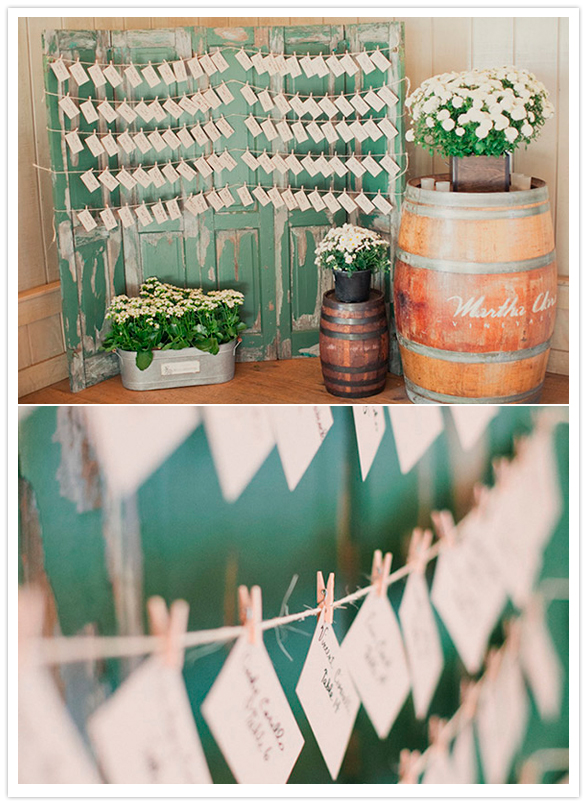 escort card garland hanging on rustic barn doors