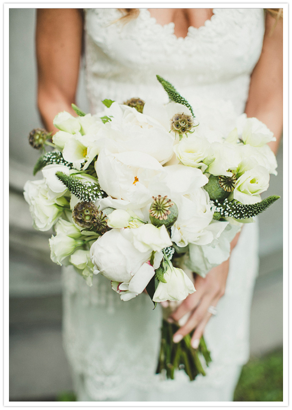 all white peonies, garden roses, ranunculus, scabiosa blooms and pods wedding bouquet