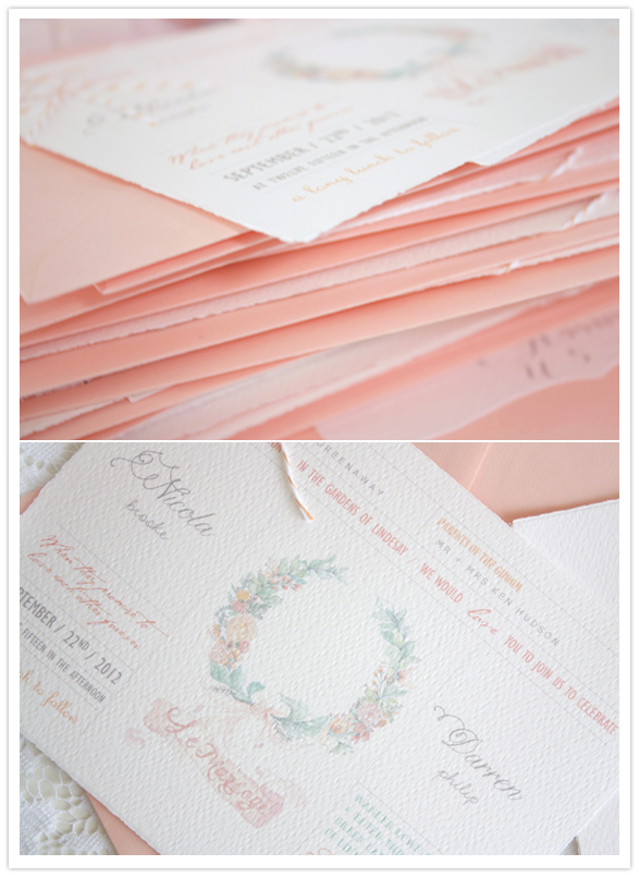 peach envelopes and floral wreathe invitations