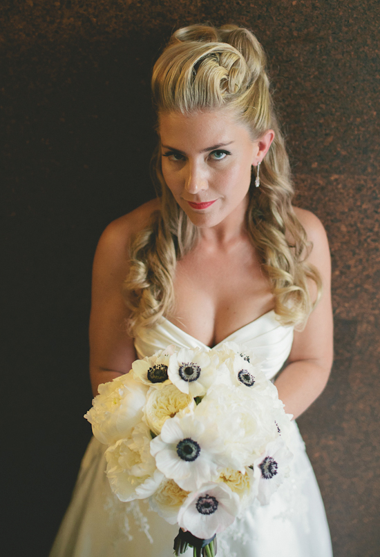 sweetheart cut dress and black and white anemones bouquet