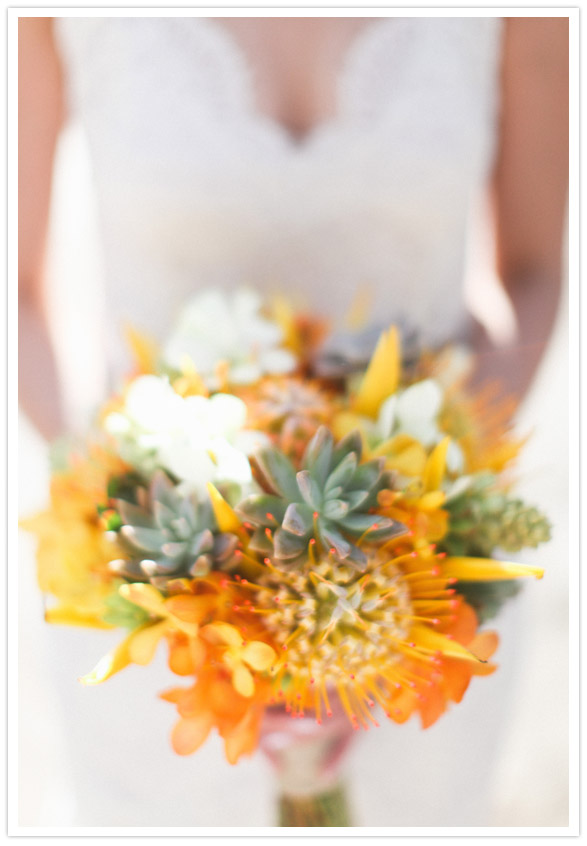 Orange floral and succulent bouquet by http://bellabloomsfloral.com