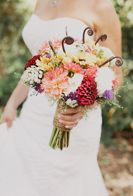 Locally grown summer flowers in bright, mixed colors with stems wrapped in natural sisal fiber rope | Photo by Michele M. Waite