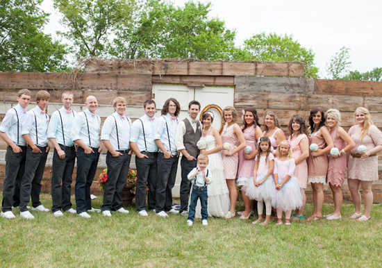 suspenders and blush pink wedding party wardrobe