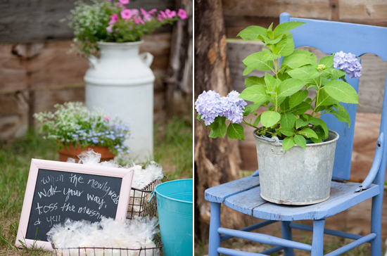 potted plants, rustic chairs and chalkboard sign