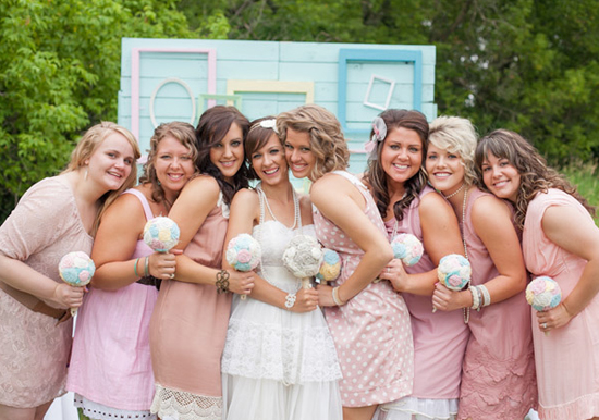 blush pink bridesmaid dresses and fabric rosette bouquets