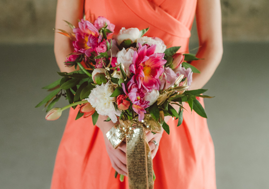 Vibrant pink, white purple bouquet and gold sequined ribbon