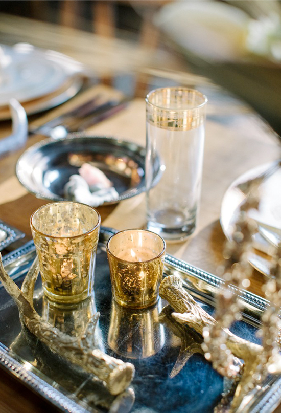 mercury candle holders and gold trimmed glasses | Photo by Haley Sheffield