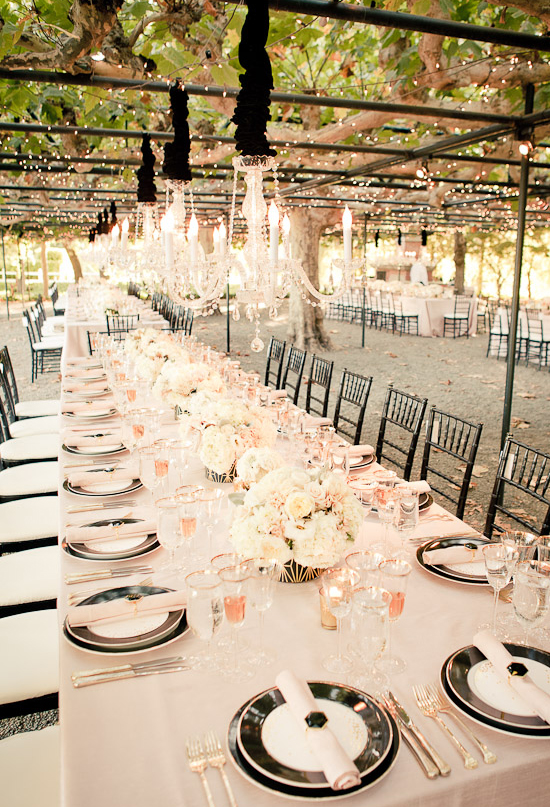covered garden wedding reception with crystal chandeliers and black jewel accents