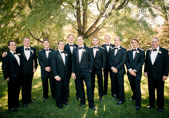 black suits and bow tie groomsmen