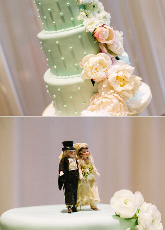 mint green polkadot and floral wedding cake with vintage bride and groom topper