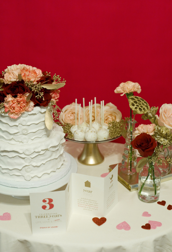 white ruffle cake and flower topper