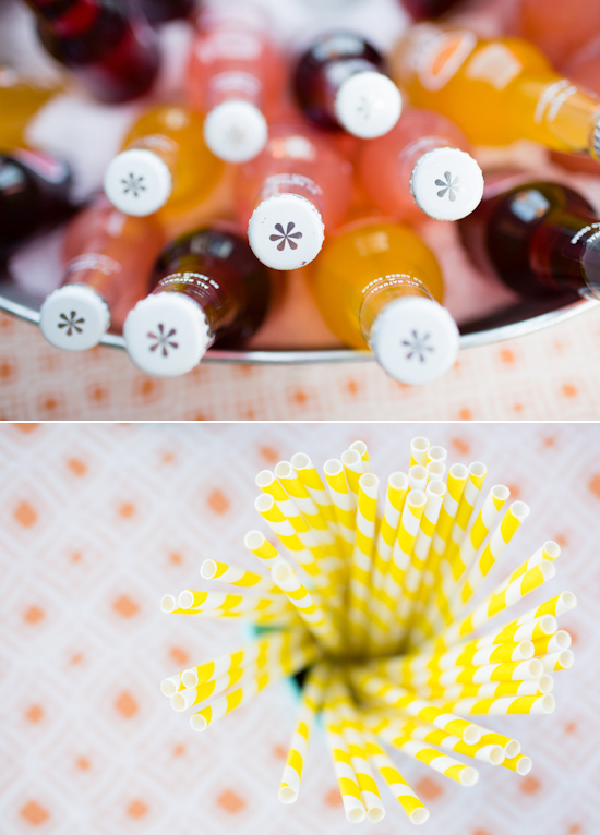 colorful bottled sodas and yellow striped straws