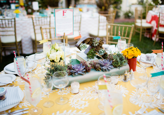 long succulent centerpieces and colorful floral accents and linens