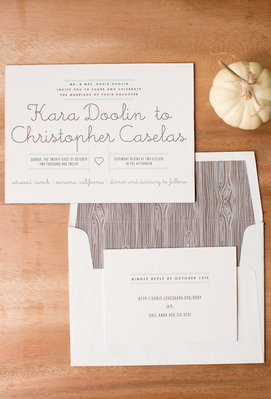 simple white invitations and wood grain envelope liner