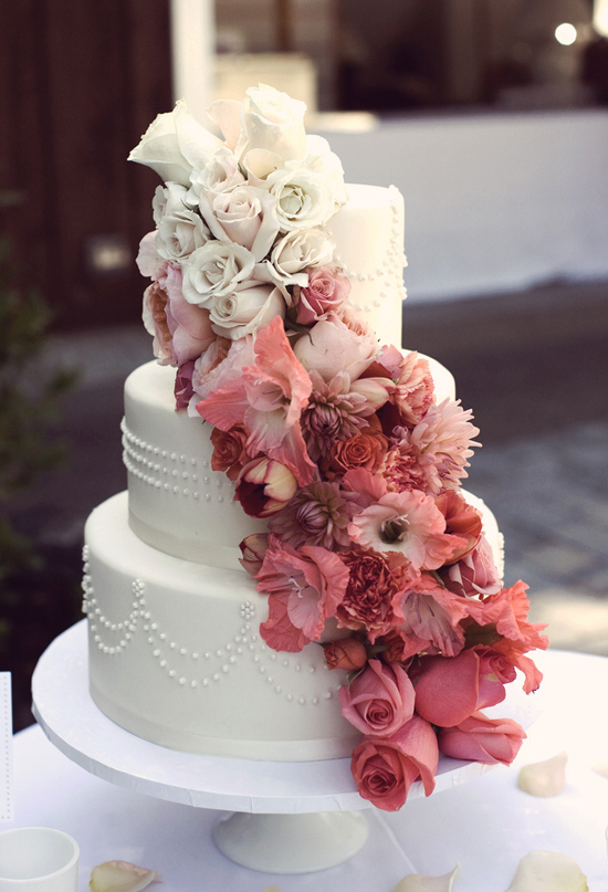 cascading cream and pink floral wedding cake  | Photo by Anne Nunn Photography