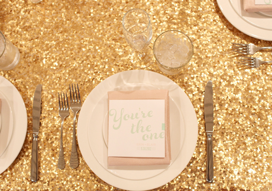 gold sparkle table cloth and pink napkins | Photo by Kimberly Genevieve