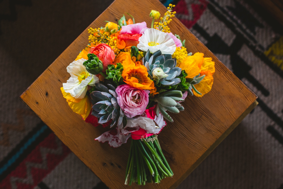 Poppy, ranunculus and succulent bridal bouquet  | Photos by EP Love | 100 Layer Cake