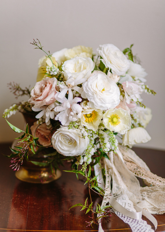 Ivory rose, ranunculus and poppy bridal bouquet | photos by Annabella Charles Photography | 100 Layer Cake