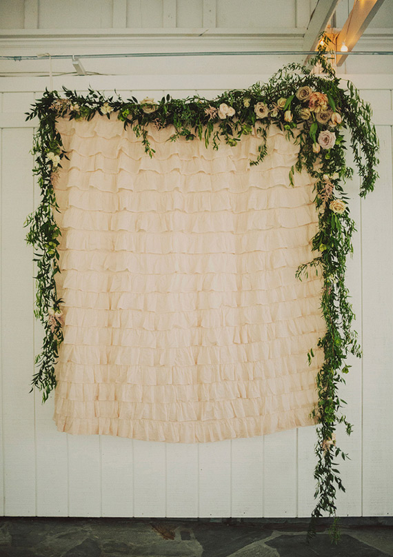 floral garland ceremony backdrop | photo by Ariel Renae Photography | 100 Layer Cake 