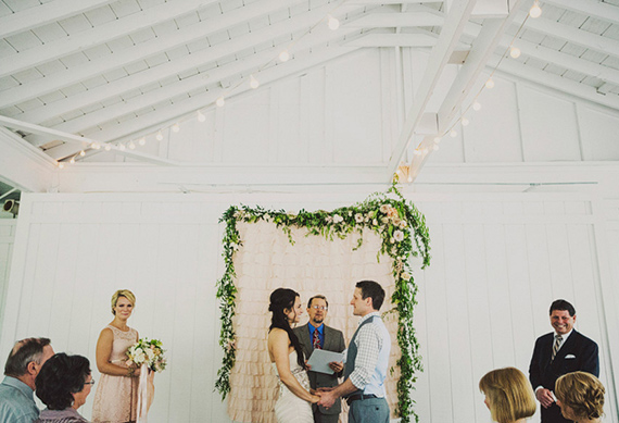 floral garland ceremony backdrop | photo by Ariel Renae Photography | 100 Layer Cake 
