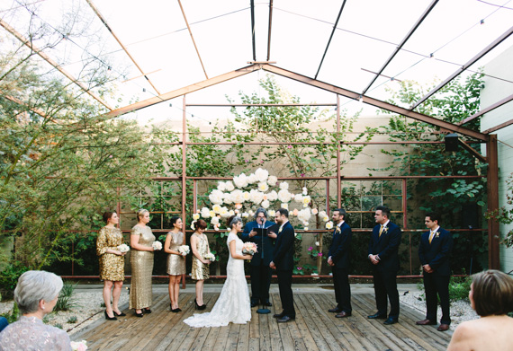 Paper flower ceremony backdrop | Photo by Mary Costa Photography | Read more - http://www.100layercake.com/blog/wp-content/uploads/2015/04/DIY-Elysian-Los-Angeles-Wedding