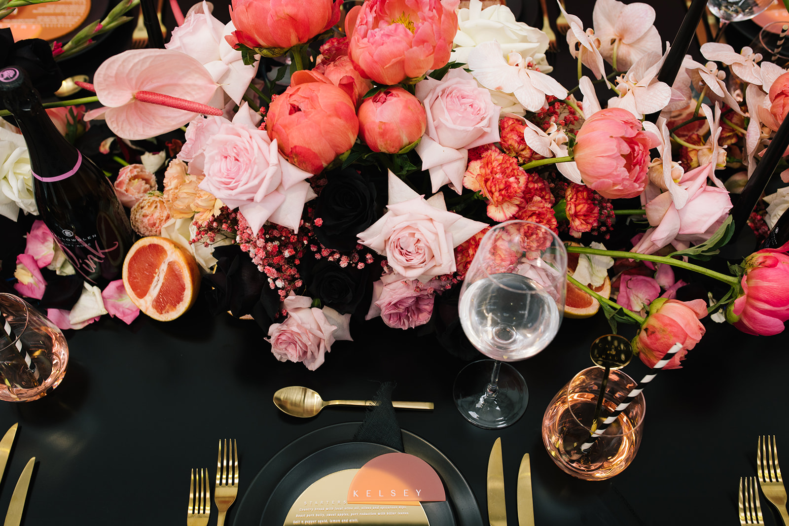 pink and black tablescape and florals with gold details