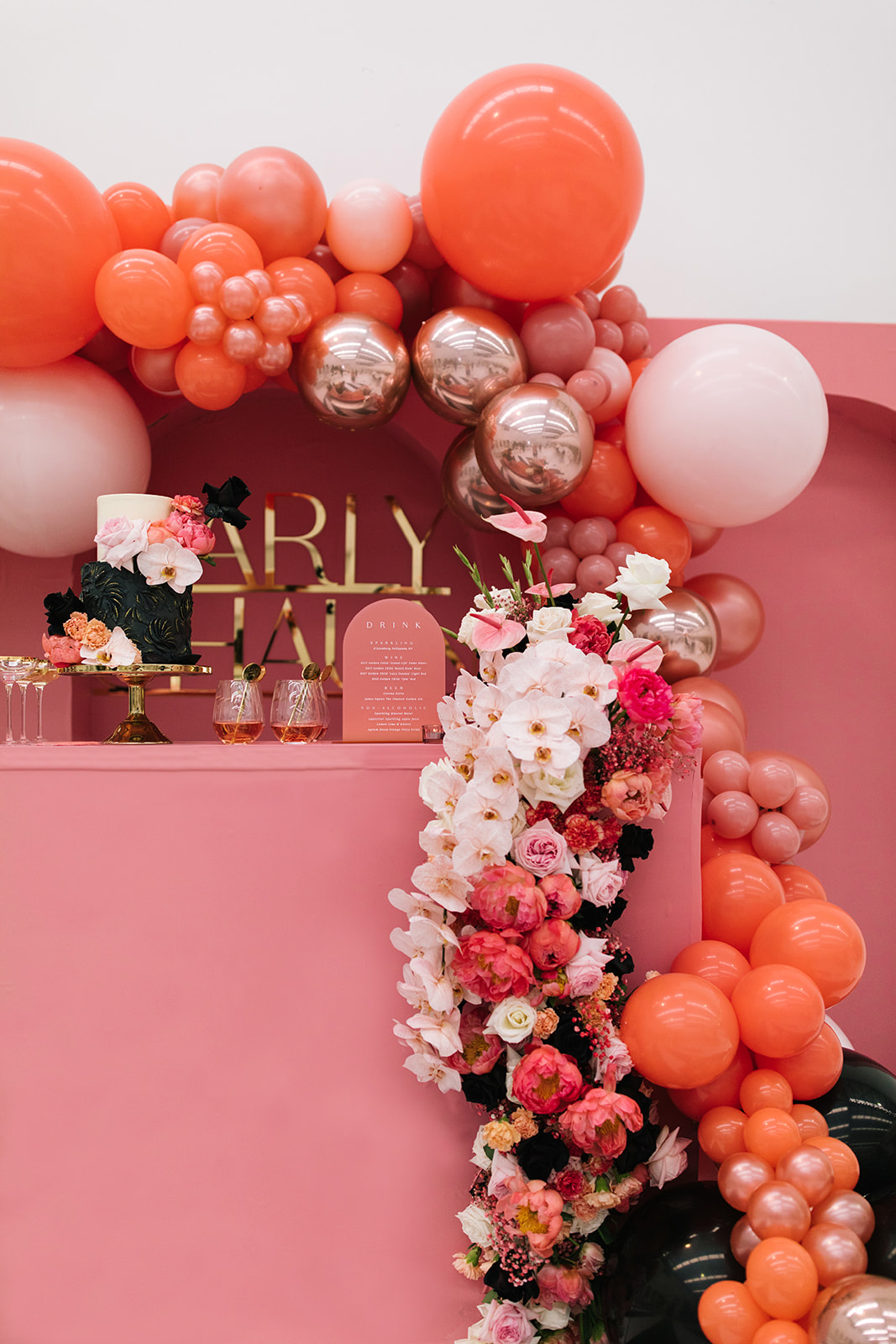 orchids and balloon garland