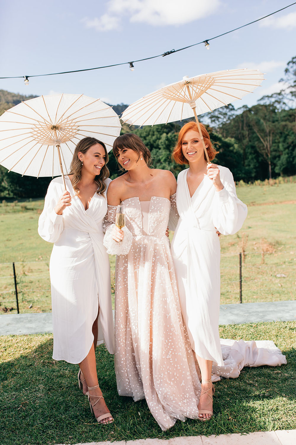 bridal party with parasols for wedding