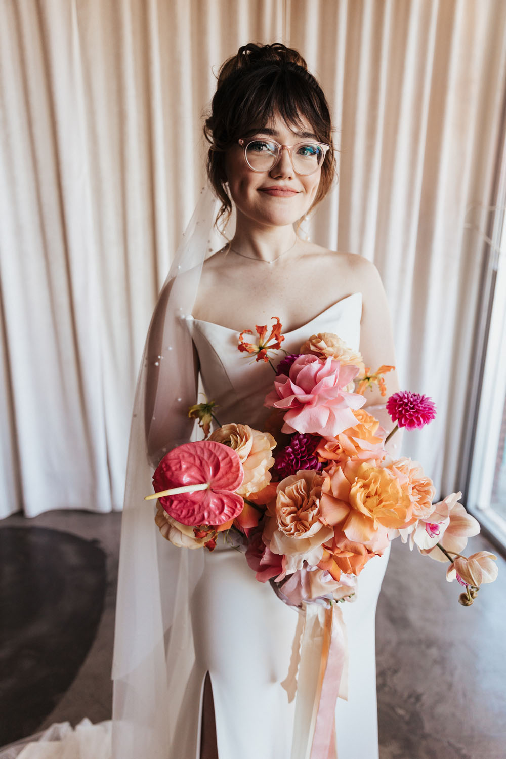 vintage bride with pink and peach wedding bouquet
