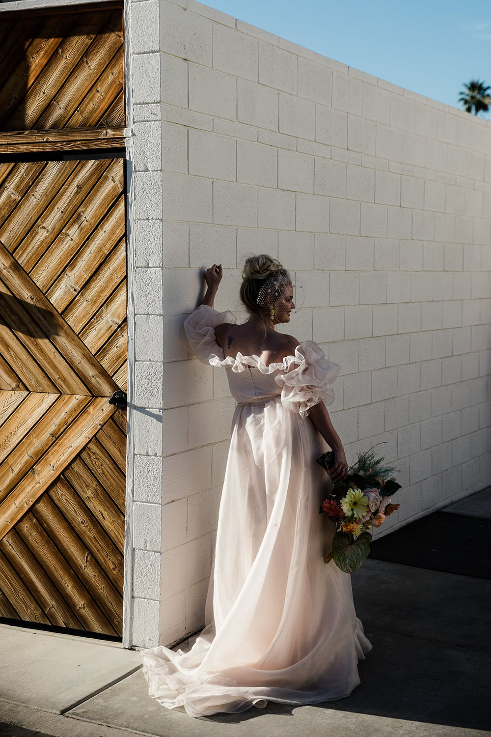 Colorful Ace Hotel Palm Springs wedding with a pool party
