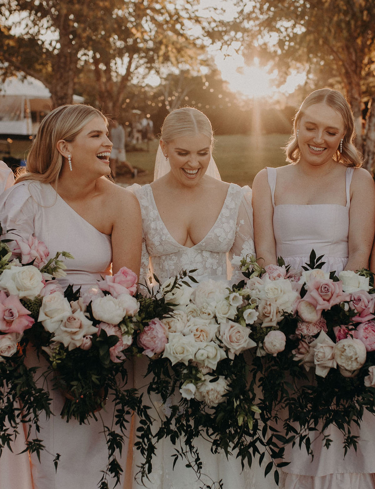 blush bridesmaid dresses and bridal party bouquets