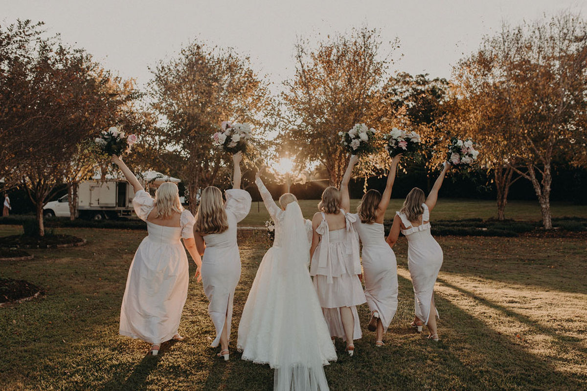 blush bridal party for elegant green and white wedding