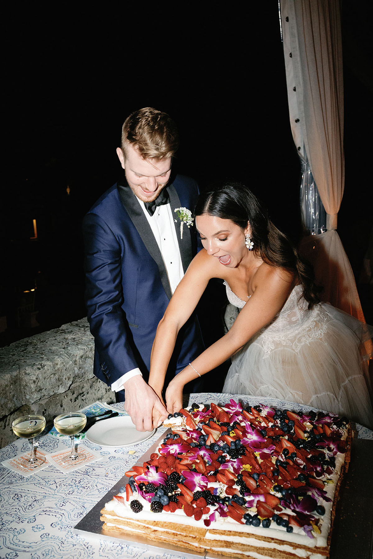 cutting an Italian wedding cake