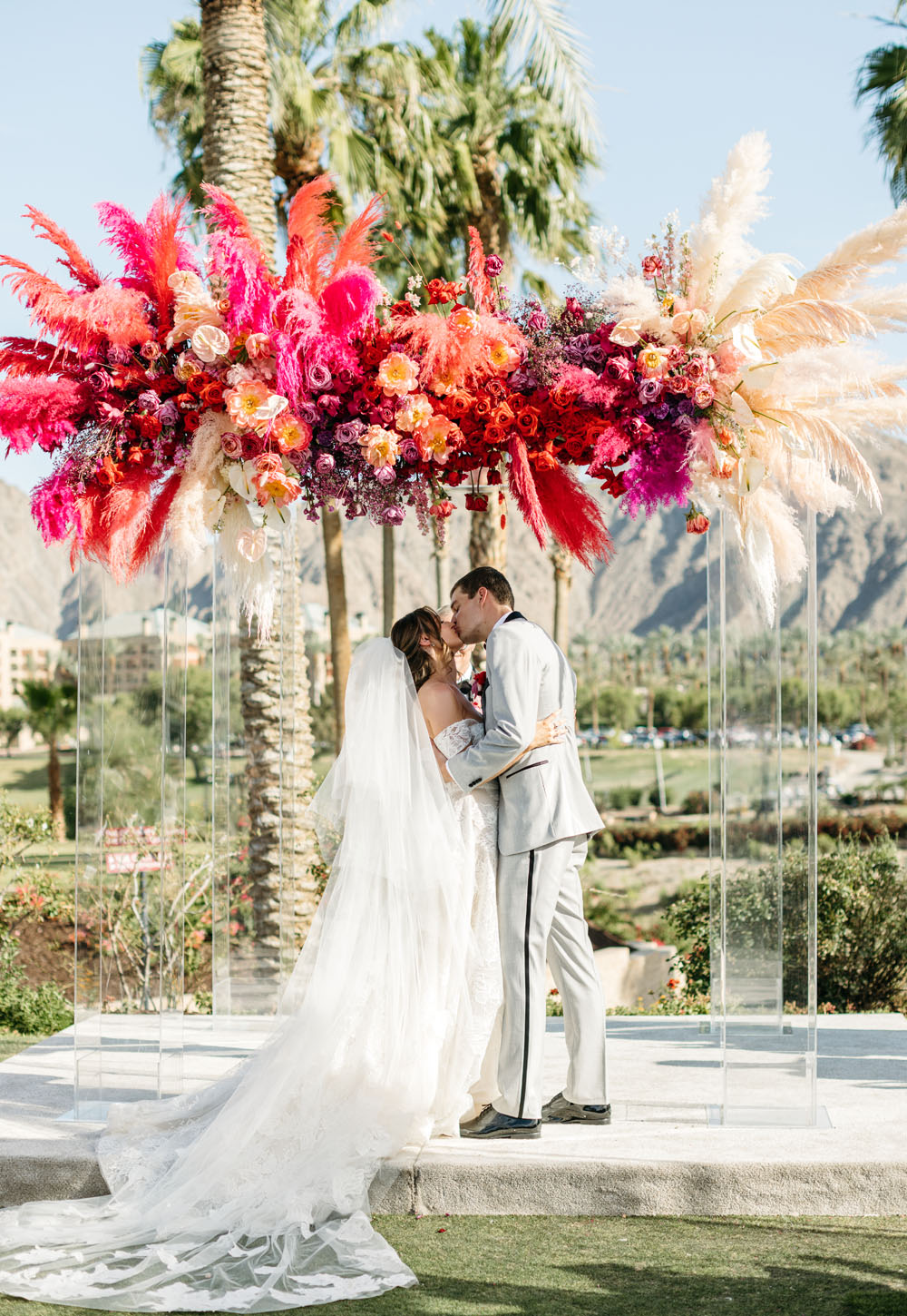 colorful ceremony florals with pampas grass