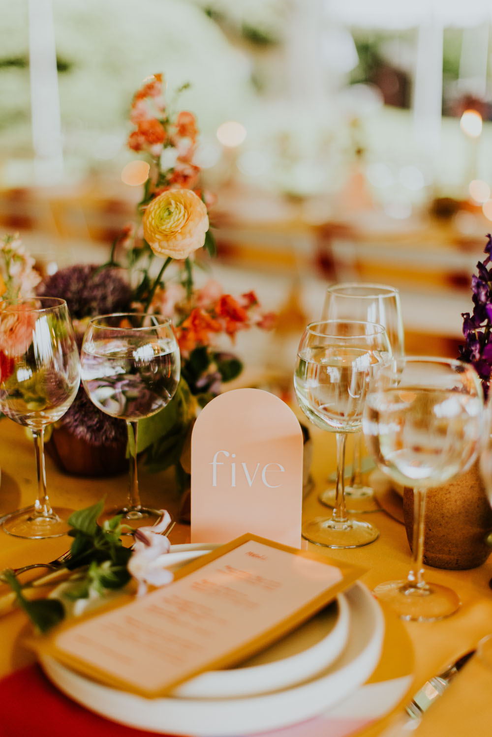 colorful place setting and table numbers