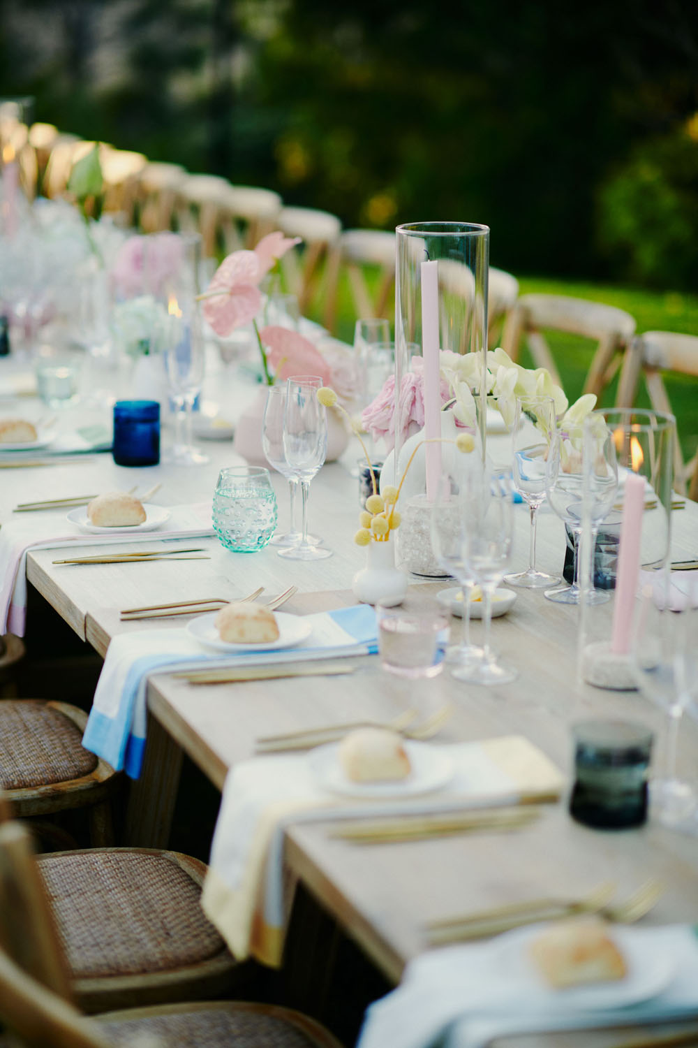 colorful place settings and white tablescape